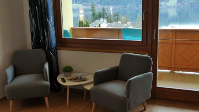 Family room with balcony with lake view